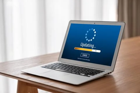 Software update on computer for modish version of device software Stockfoto's