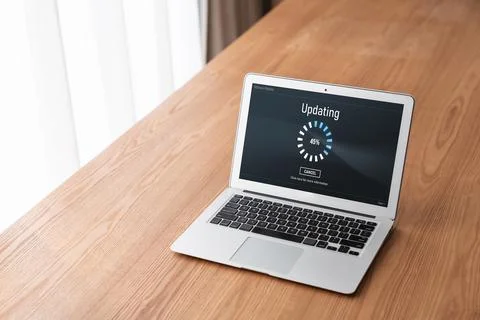 Software update on computer for modish version of device software Stock Photos