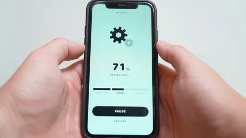 Software update installing on smartphone screen with progress percentage and Stock Footage 342603332