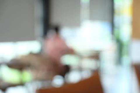 Softy blurred view of a modern cafe or lounge interior featuring comfortabl.. Stock Photos