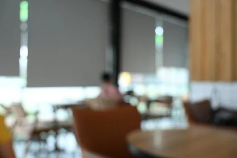 Softy blurred view of a modern cafe or lounge interior featuring comfortabl.. Foto stock