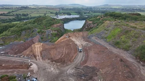 Soil being transported and spread inside a disused quarry in Waterford, 動画素材 345086725