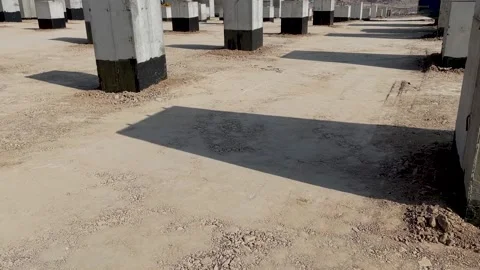 Soil compaction between foundations using vibratory rollers Stock Footage 239827855