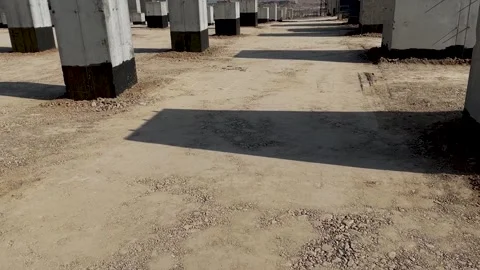 Soil compaction between foundations using vibratory rollers Stock Footage 240491315