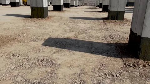 Soil compaction between foundations using vibratory rollers Stock Footage 241094098