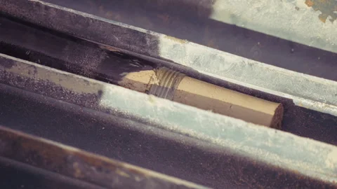 Soil Core Sample Removed from Drilling Pipe Stock Footage 330129272
