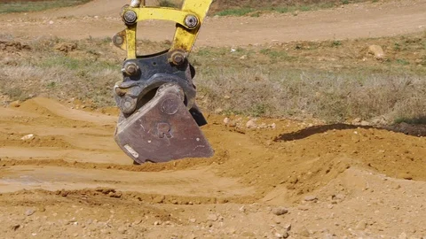 Soil digging machine preparing terrain. Slow motion Close up. Stock Footage 116788916
