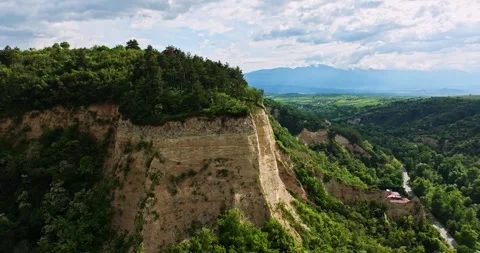 Soil Erosion Cliffs Vibrant Landscape Sunny Day Aerial Orbit Descend Stock Footage 289410322