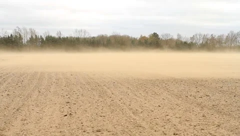 Soil erosion on a field during a heavy storm, dust storm Stock Footage