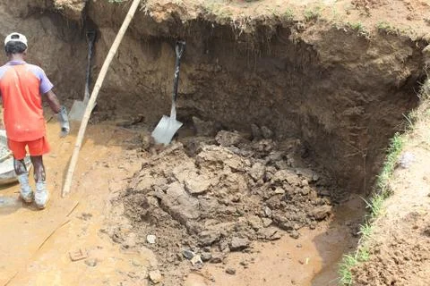 Soil falling in to the hole Stock Photos