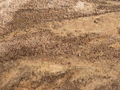 Soil on the ground as texture and background. Top view shot Stock Photos