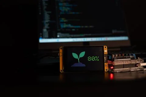 Soil moisture display screen with IoT microcontroller operation, Smart farm.. Stock Photos