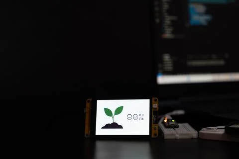 Soil moisture display screen with IoT microcontroller operation, Smart farm.. Stock Photos