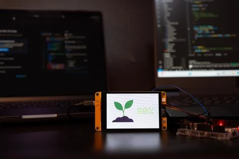 Soil moisture display screen with IoT microcontroller operation, Smart farm.. Stock Photos