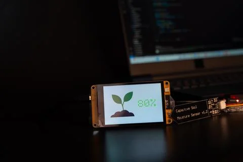Soil moisture display screen with IoT microcontroller and soil moisture sen.. Stock Photos