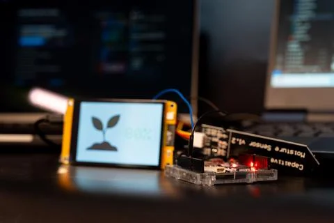 Soil moisture display screen with IoT microcontroller operation, Smart farm.. Stock Photos