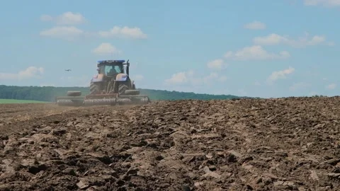 Soil processing with a disc aggregate attached to a tractor Stock Footage 166947048
