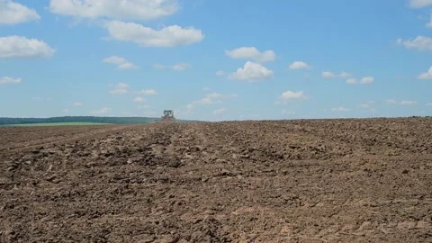Soil processing with a disc aggregate attached to a tractor Stock Footage 166947054