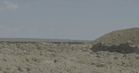 Soil roller compacts soil, sand, road roller with spikes, construction work Stock Footage 305641540