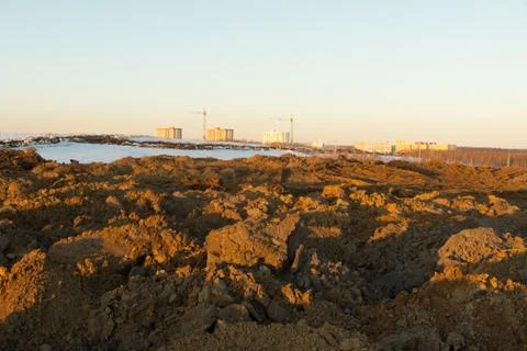 Soil storage during construction, large piles of excavated soil piled up from Stock Photos