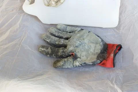 Soiled worker gloves on white background Stock Photos