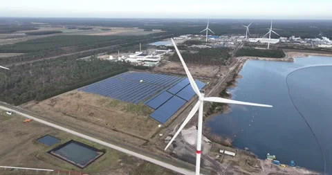 Solar and wind energy generation at industrial zone in Belgium. Next to a Stockbeeldmateriaal 266922569