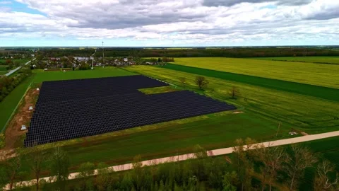 Solar array creating clean electricity, supporting green energy transition and Stock-Footage 334002981