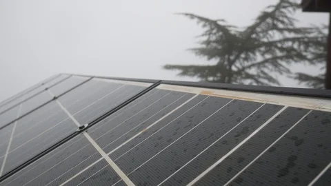 Solar battery in cloudy rainy weather on top of a mountain. Vídeos de archivo 125712860