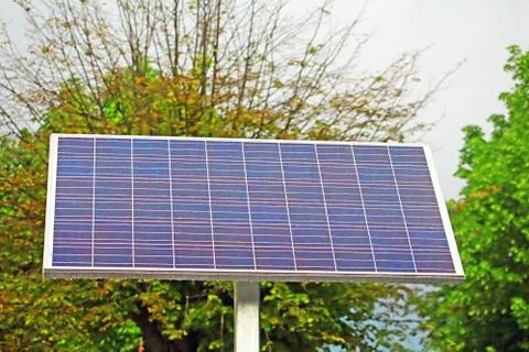 Solar battery with trees background Stock-Fotos