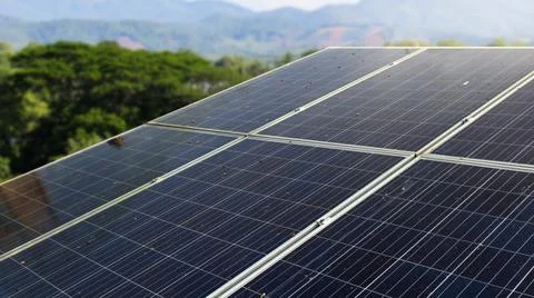 Solar cell panels under the evening sunlight become dirty caused by bird poops Stock Photos
