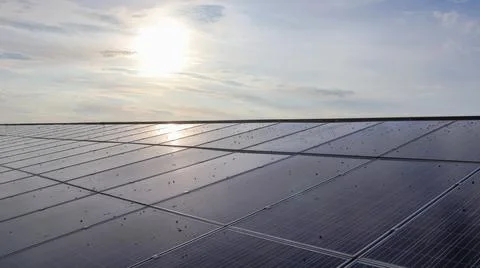 Solar cell panels under the evening sunlight become dirty caused by bird poops Stock Photos