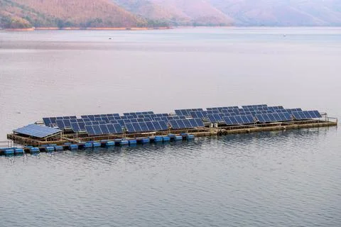 Solar cell system panel renewable power floating on dam Stock Photos