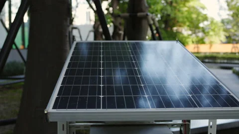 Solar cells panel are in the garden to store solar energy. Environmental  Stock Footage 142643498