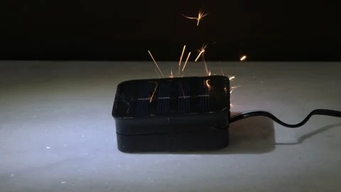 Solar charging device sparks due to malfunction creating fire risk and damage 스톡 동영상 332170474