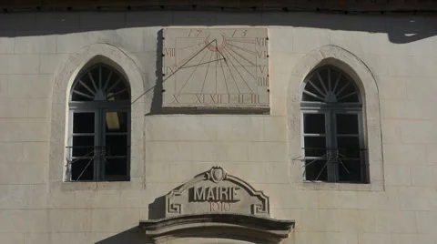 Solar clock on the facade of Lacoste Town Hall Provence France tilt Stock Footage 66367276