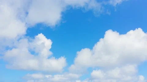 Solar cloudscape background. Beautiful white clouds in blue summer sky. Stock Footage 153940383