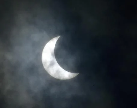 Solar eclips with clouldy sky Fotos Stock