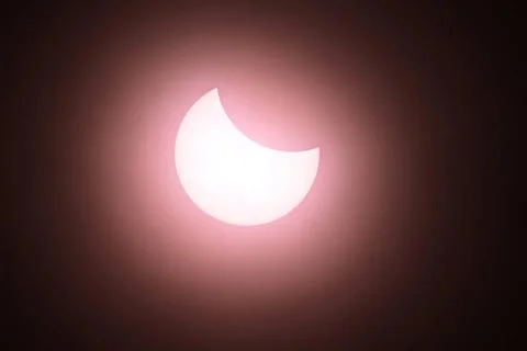  Solar Eclipse 11 am and the eclipse is at its peak. A Partial Solar Ecli.. Stock Photos