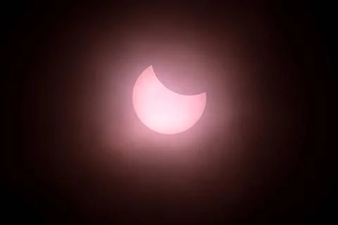  Solar Eclipse 11 am and the eclipse is at its peak. A Partial Solar Ecli.. Stock Photos