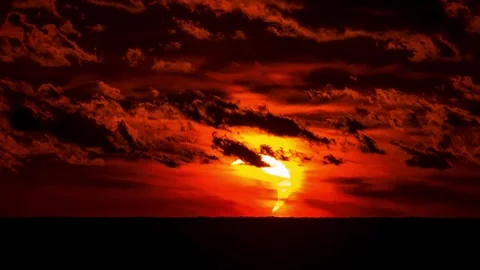 Solar eclipse of 2026 at sunset with clouds over the horizon Stock Footage 342173302