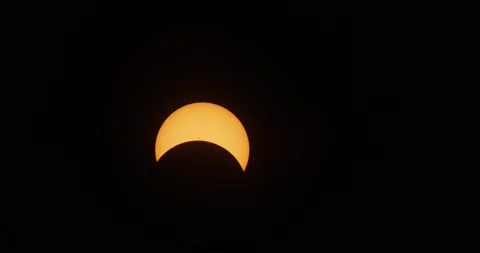 Solar eclipse with 50% moon coverage and prominent sunspots. Stock Footage 271599781