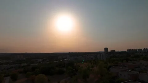 Solar Eclipse Above Distant Urban Skyline Stock Footage 344440463