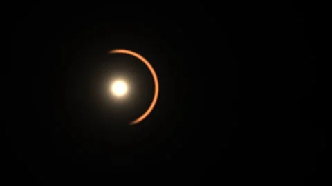 Solar eclipse with a bright sun and dark background Stock Footage 338230118