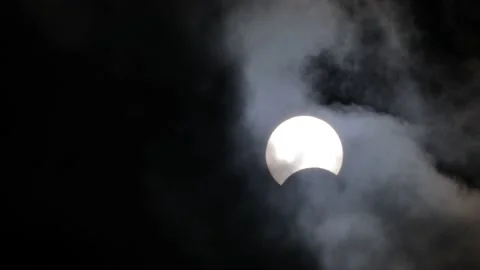 Solar eclipse in the clouds Stock Footage 134369173