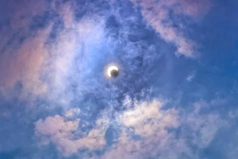 Solar eclipse in the clouds Stock Photos