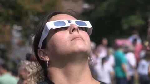 Solar eclipse on college campus and students with telescopes and glasses Stock Footage 79091646