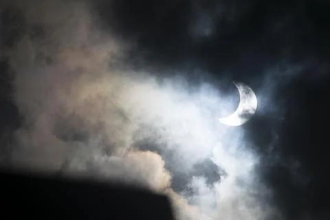 Solar eclipse covered by clouds , in Argentina Stock Photos