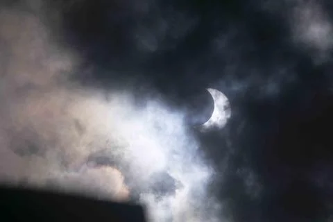 Solar eclipse covered by clouds , in Argentina Stock Photos