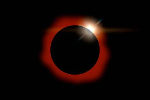 Solar Eclipse on Dark Sky Solar eclipse with orange halo on black sky back... Fotos Stock
