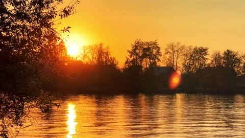 A solar eclipse during a mesmerizing fiery sunset. Majestic sunset or sunrise la Stock Footage 251652734